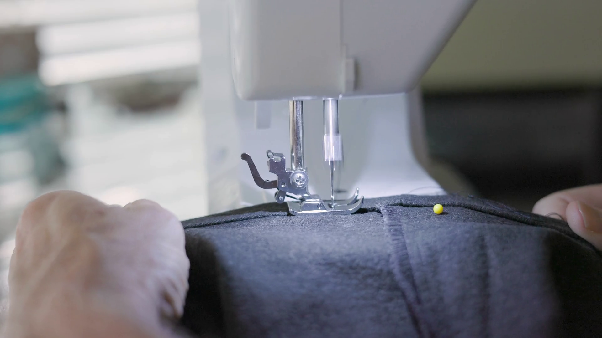 Tailor Using Sewing Machine To Hem Pants Legs Stock Footage SBV