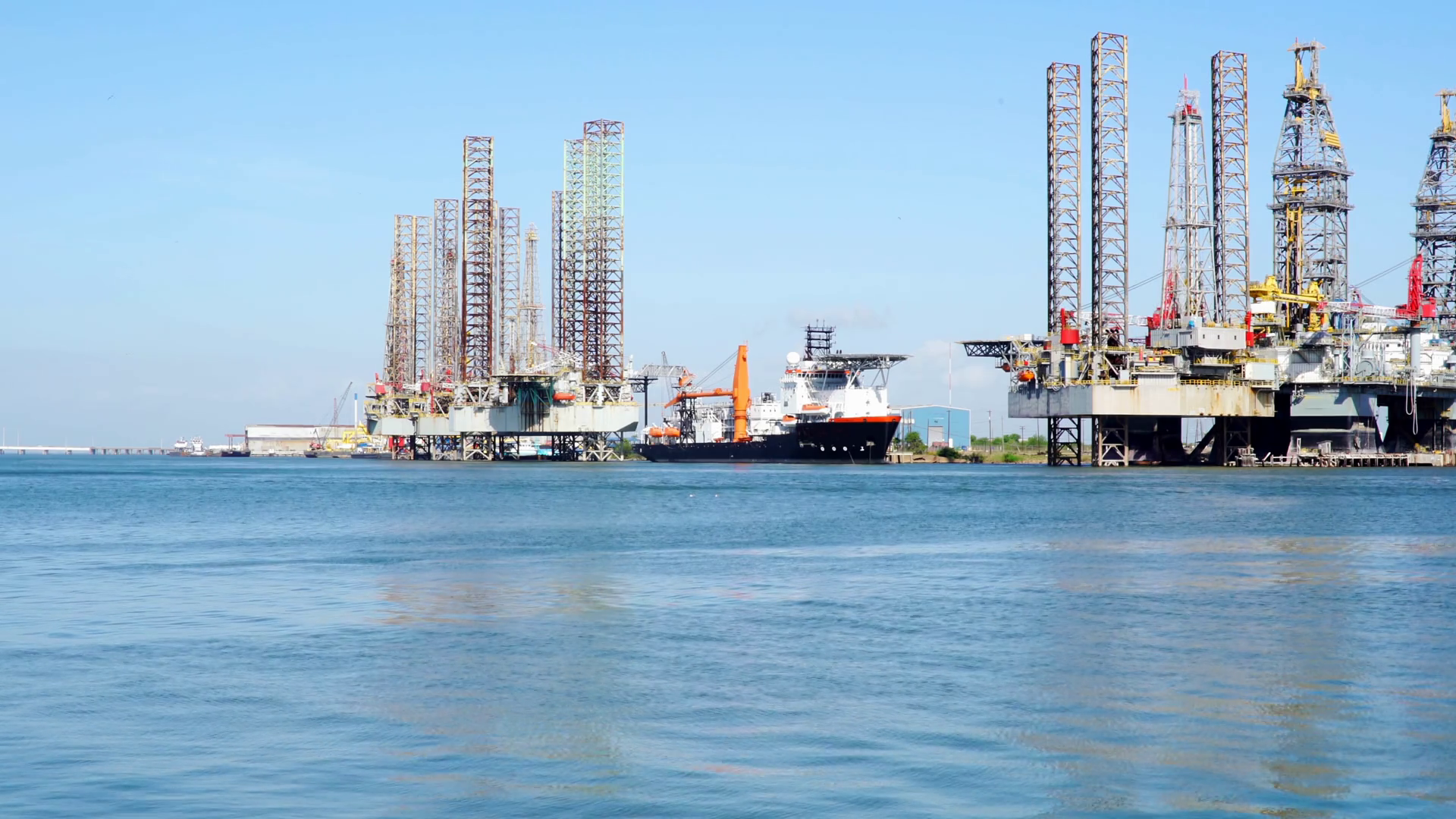 view of oil rigs and jackup barges in Galveston bay Stock Video Footage