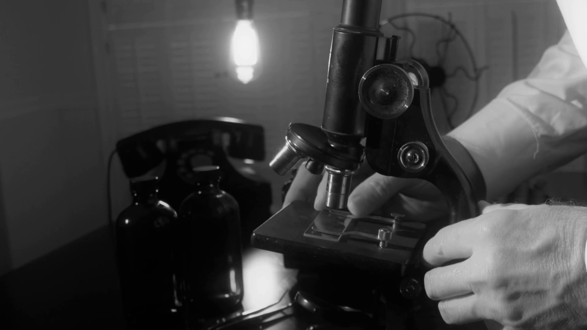 Vintage Scientist Using Microscope Stock Footage SBV300224749