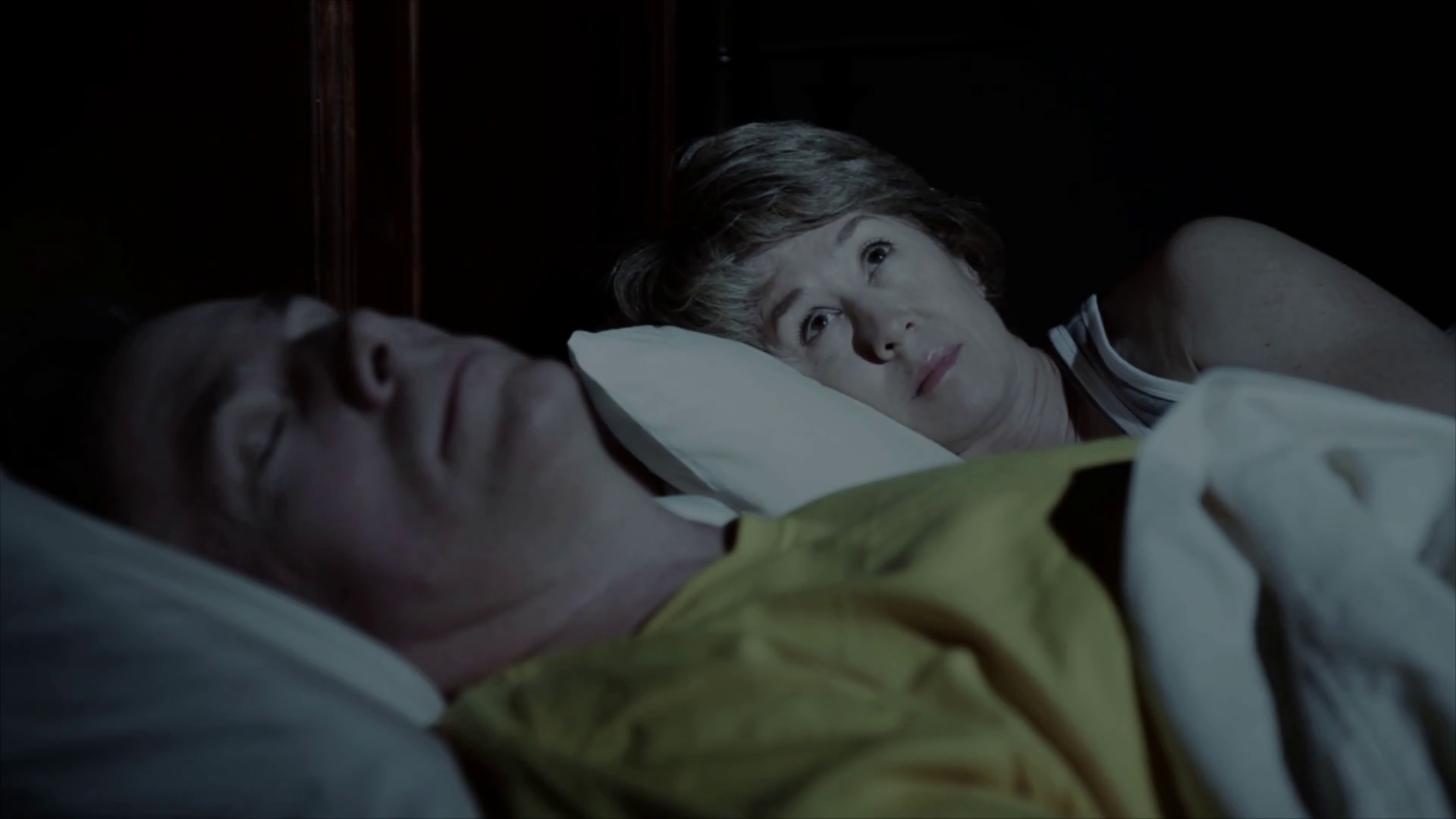 woman cant sleep while husband sleeps Stock Video Footage woman cant sleep while husband sleeps Stock Video Footage