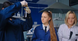 Young Students Working In Modern Chemical Laboratory, Education And Learning concept