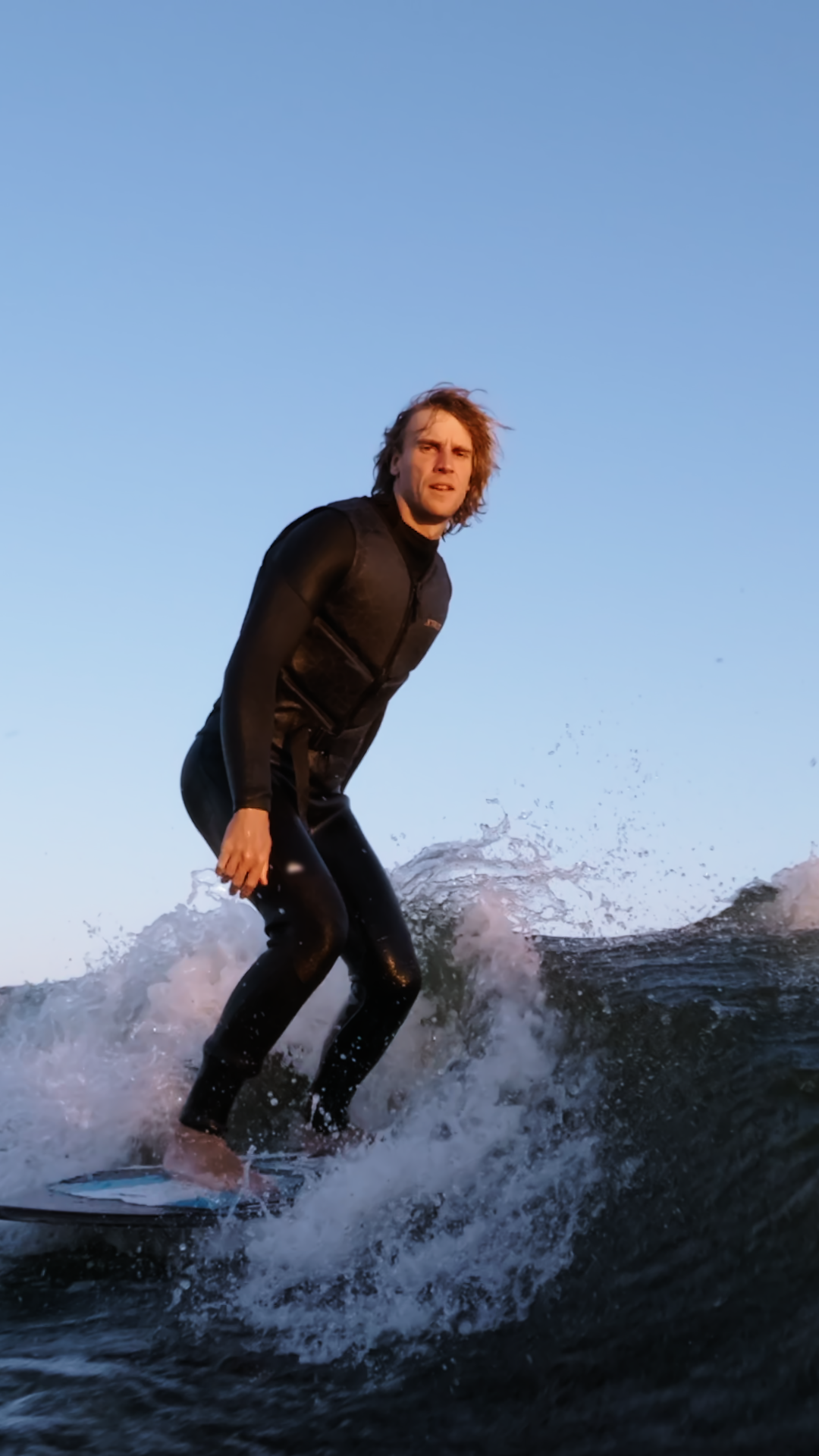 A Surfer Riding Waves At Sunset Showcasing Stock Footage SBV-353147393 ...