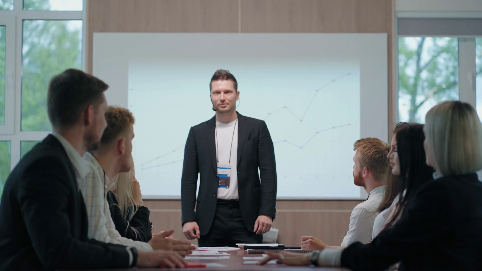 business meeting in big company, heads of departments are CEO and applauding Stock