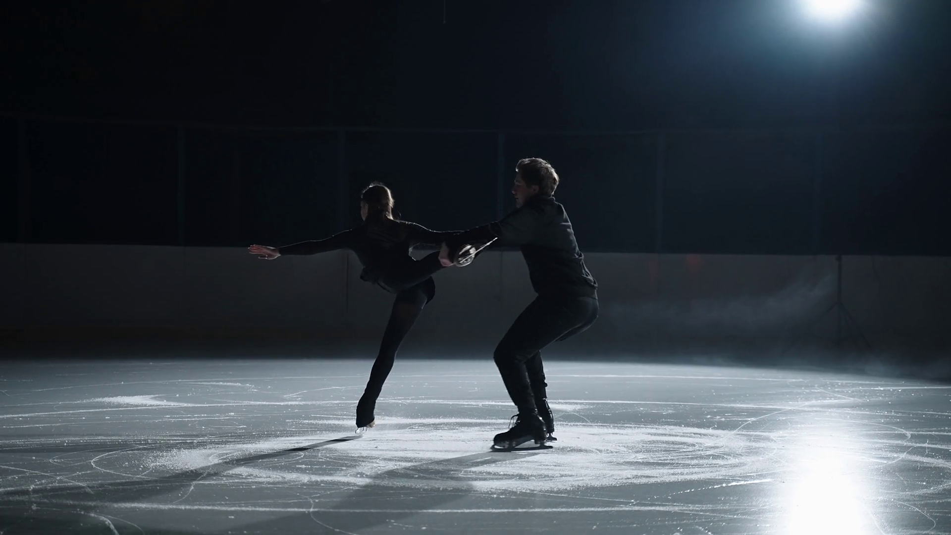 training of pair by figure skating on ice rink on empty stadium, slow