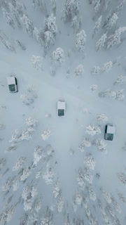 Nestled in the snowy wilderness of Akaslompolo, a cozy cabin invites winter lovers to explore the beauty of Lapland. Snow blankets the