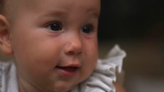 Infant Baby With Milk Running Down Mother Close Up On Face