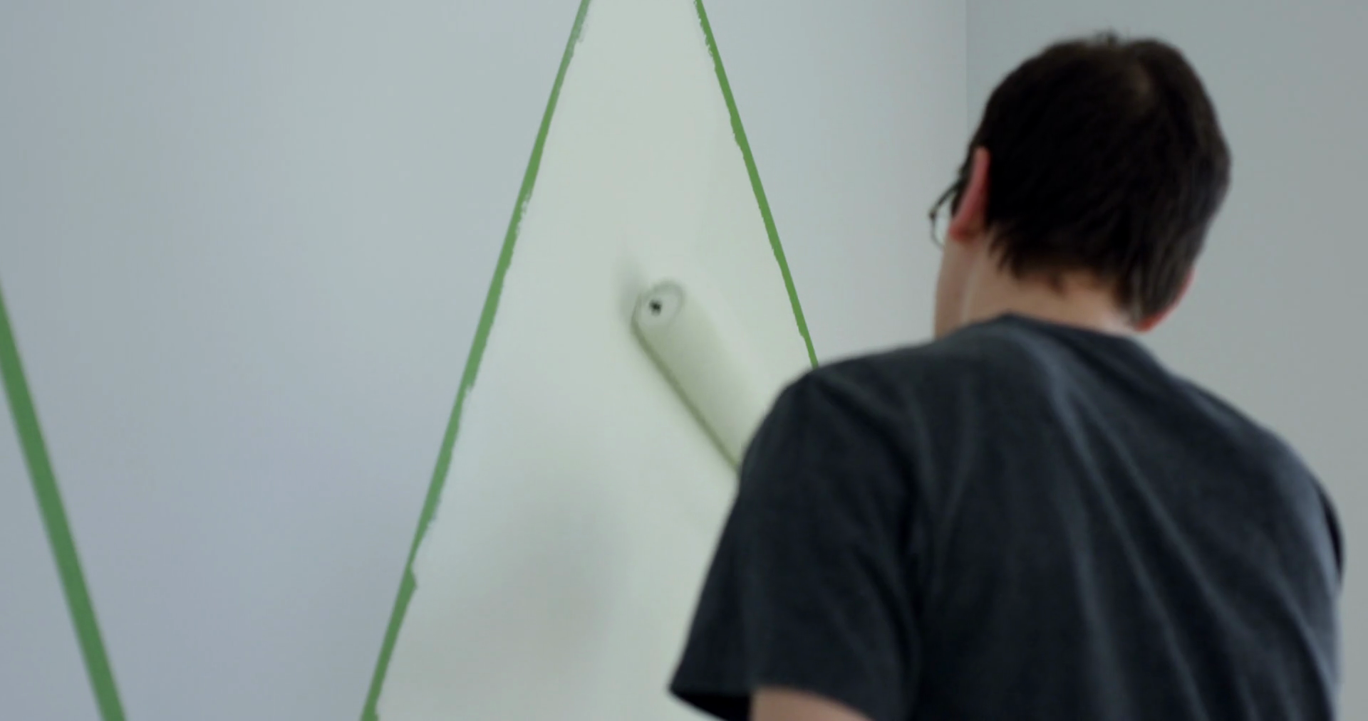 Man Painting Bedroom Walls With Paint Roller Stock Footage SBV