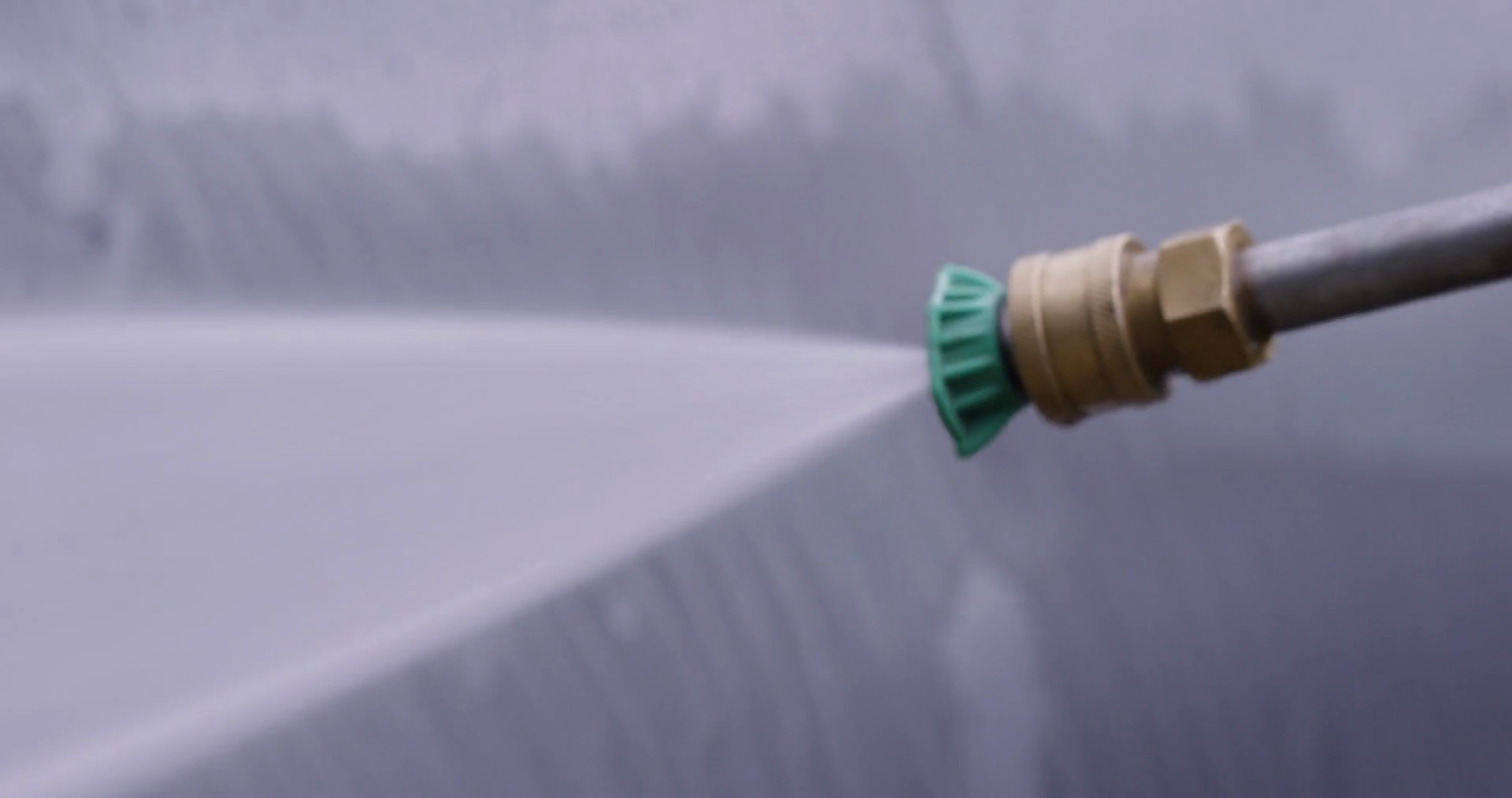 Pressure Washer Spraying Glass Extreme Close Stock Footage SBV