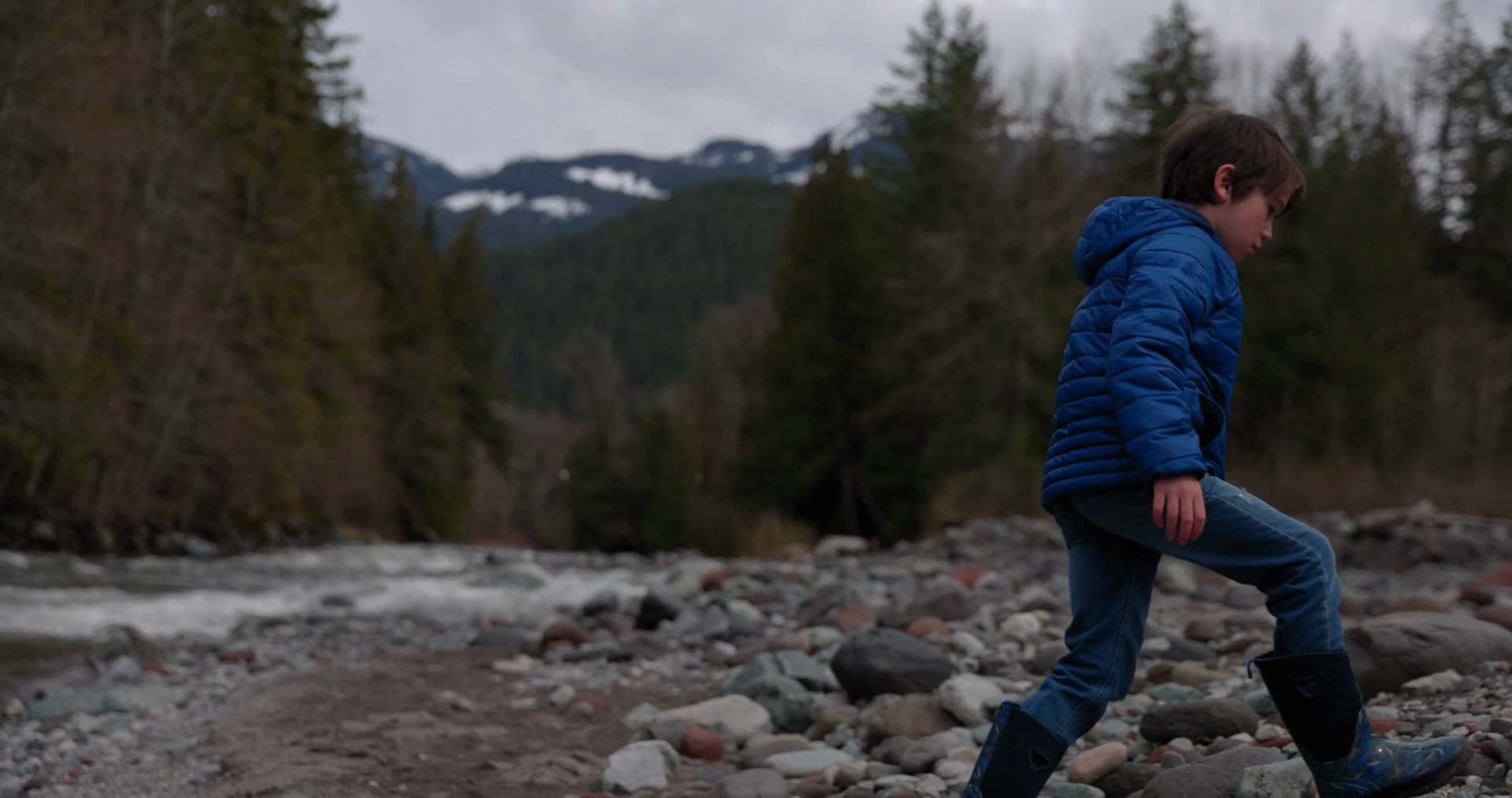 Young Boy Picking Rocks To Throw In River Stock Footage SBV-347754309 ...