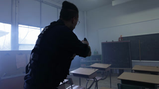 Police Officer In A Classroom At Night Arrest Action Scene