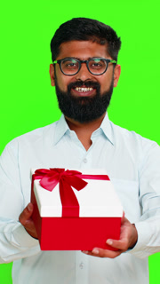 Indian man smiling offering gift birthday box kind gesture showing surprise happy giving present