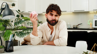 Indian man holding small piggy bank coin saving money dream about future personal savings big budget