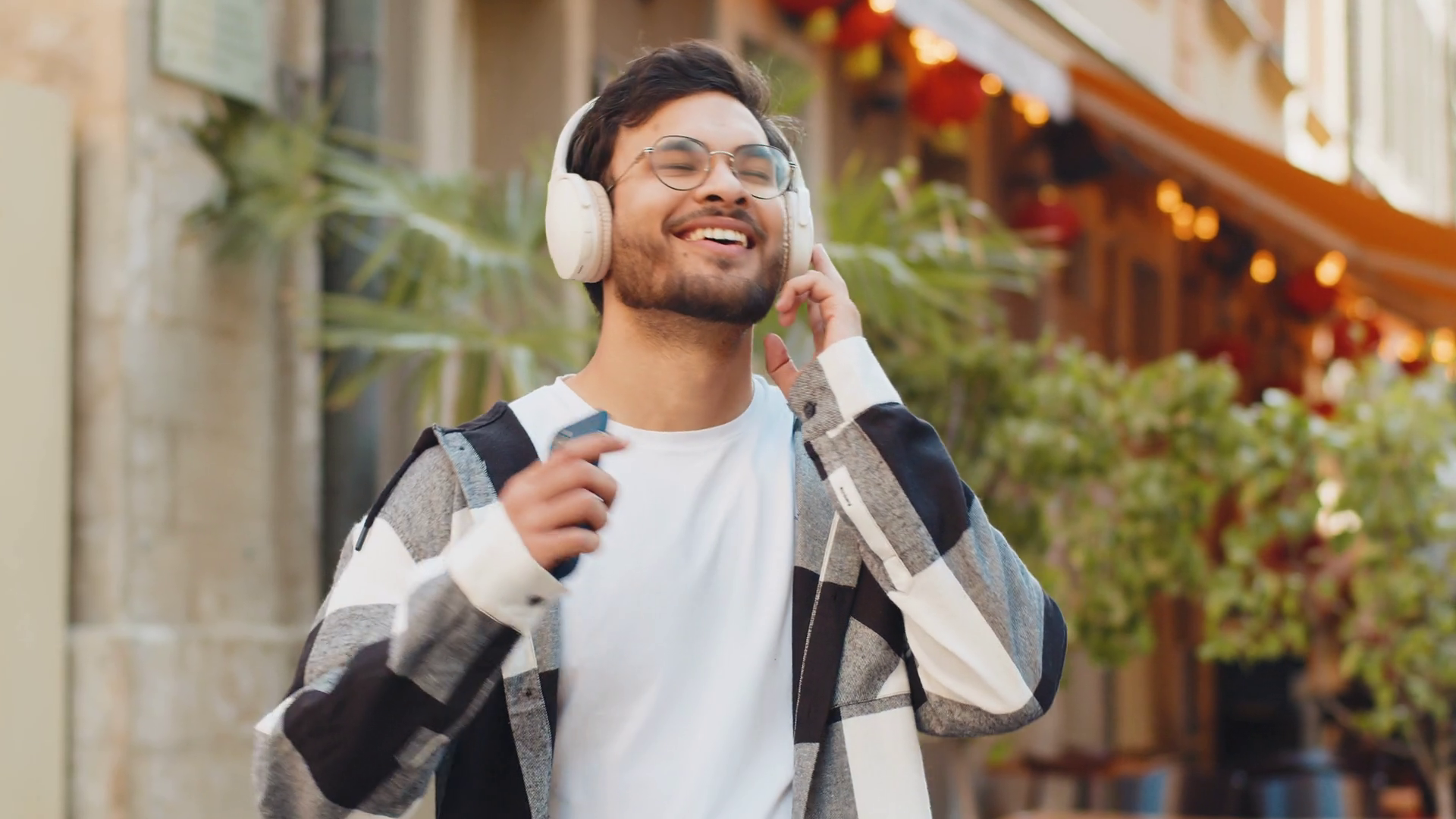 Happy Indian Man Wearing Headphones Choosing Stock Footage SBV ...