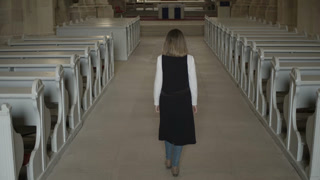 Woman walking into a church