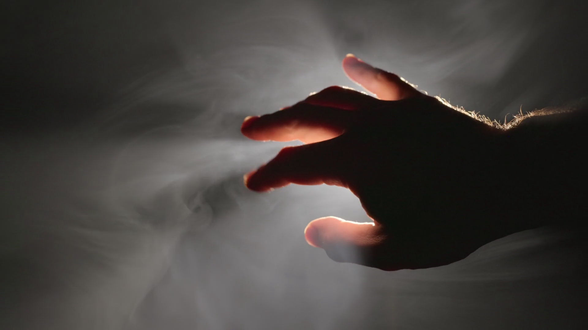 Male Hand In Backlight On Black Background Stock Footage SBV-352055440 ...