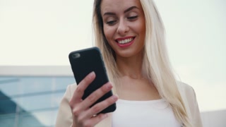 Stylish woman using mobile phone and social networks
