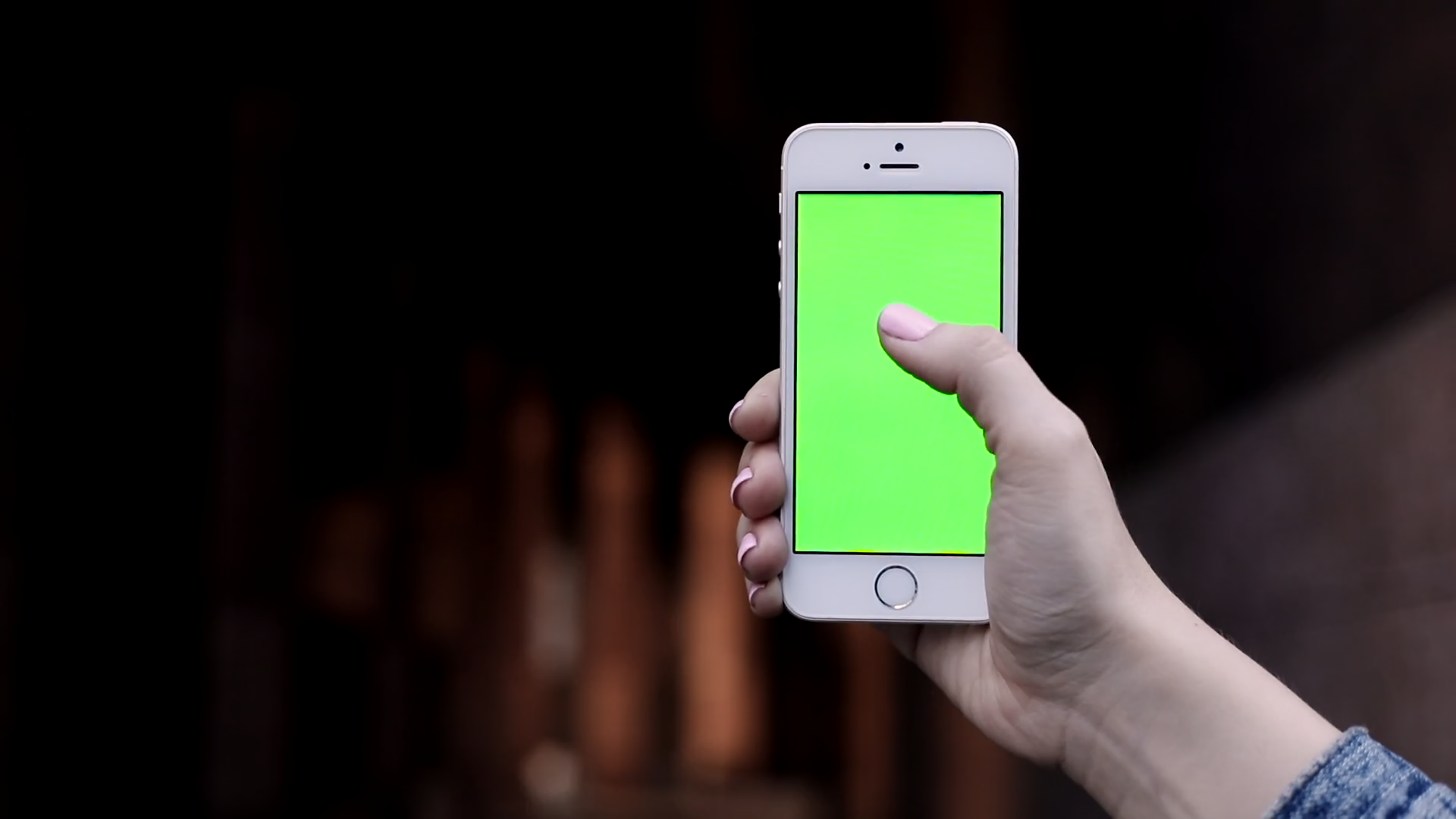 Close up view of White Modern Mobile Device. Womans Fingers Sliding on