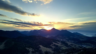 Aerial Hyperlapse of Mountain Sunset with Forward Motion