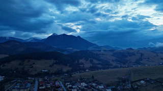 Dark Evening Mountain Village Hyperlapse with Rain Clouds