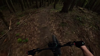 POV Video Of Mountain Biker Riding Fast On Dark Enduro Forest Trail