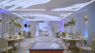 Served tables for a holiday. Wedding decoration with flowers.