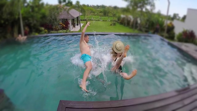 Woman Dunking Man In Swimming Pool Stock Footage: Royalty-Free Video ...