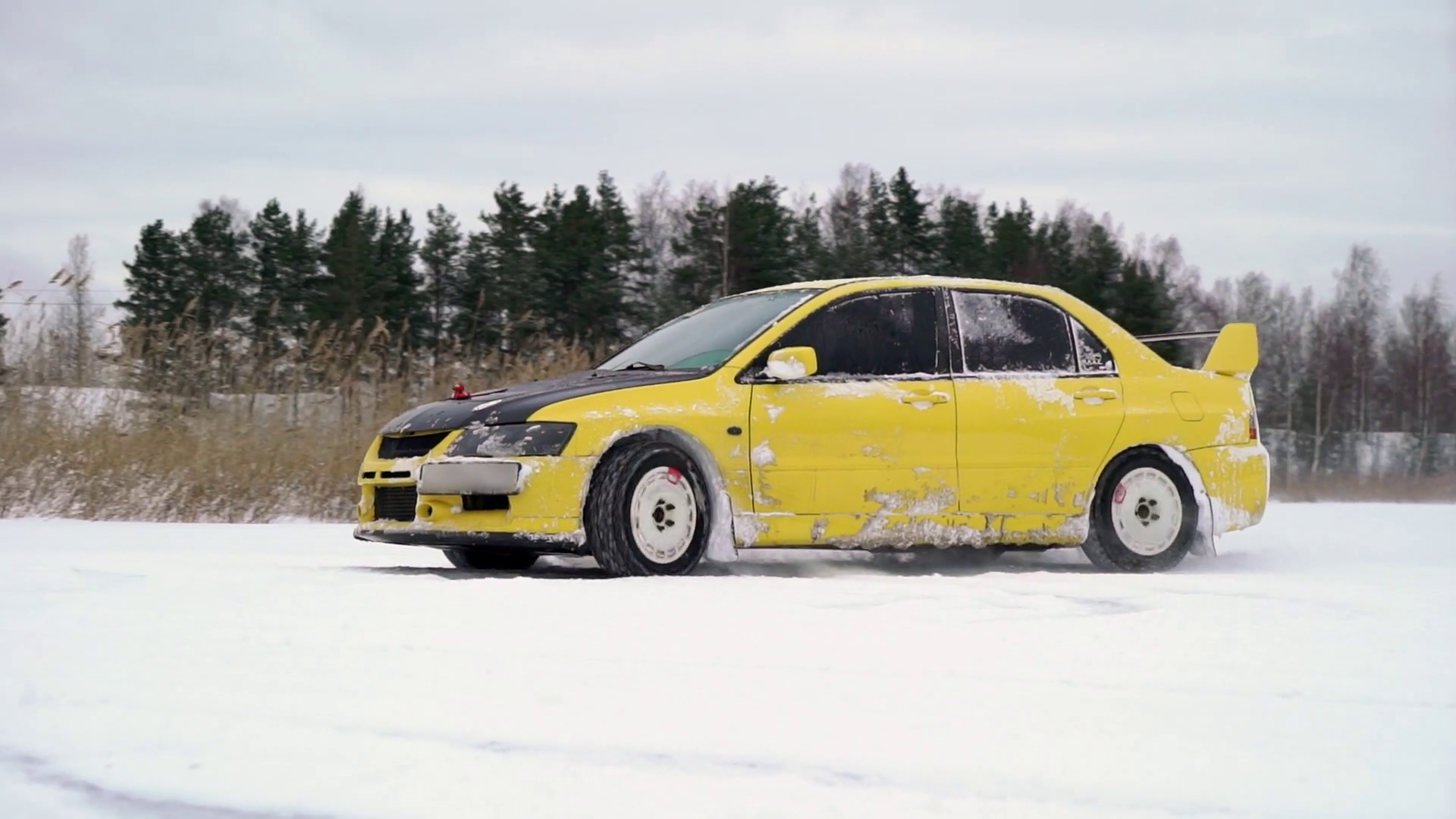 Car Drives Icy Track On Snow Covered Lake At Stock Footage SBV ...