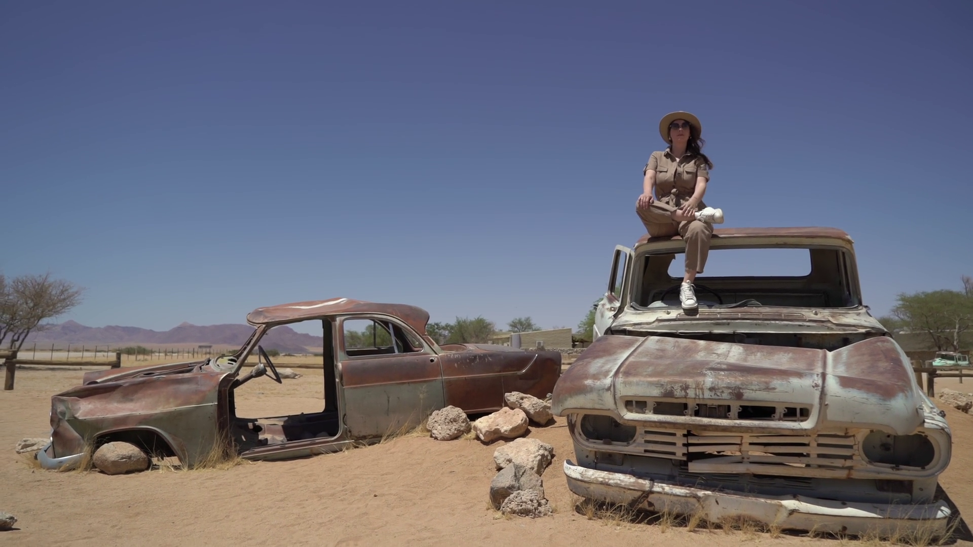 Young Woman In Safari Overalls Sits On Stock Footage SBV-352027672 ...