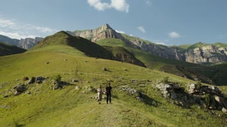 Exploring the Scenic Russian Caucasus: A Couple's Serene Walk