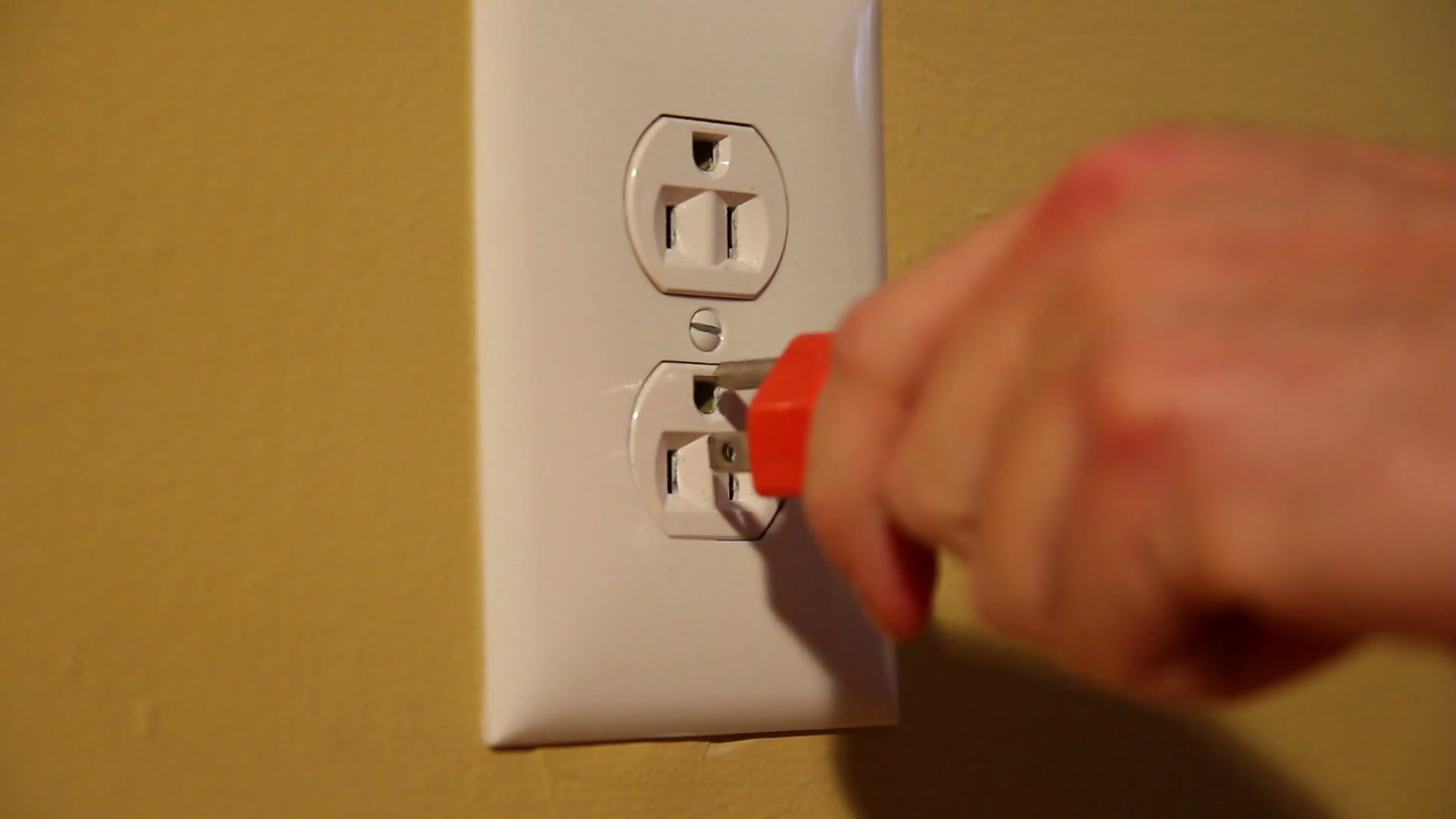 Plugging In Extension Cord In Wall Socket Stock Footage SBV300230587