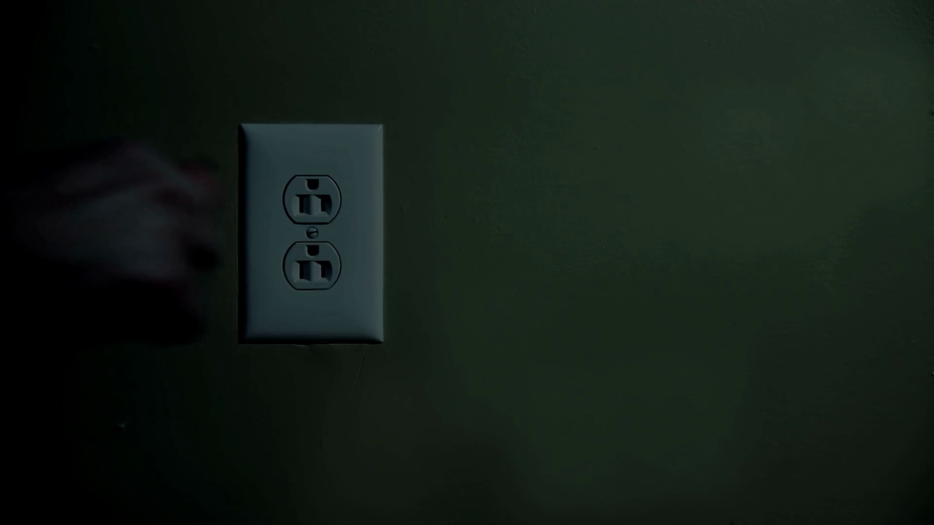 Plugging in Extension Cord in Wall Socket Detail Stock Video Footage 00