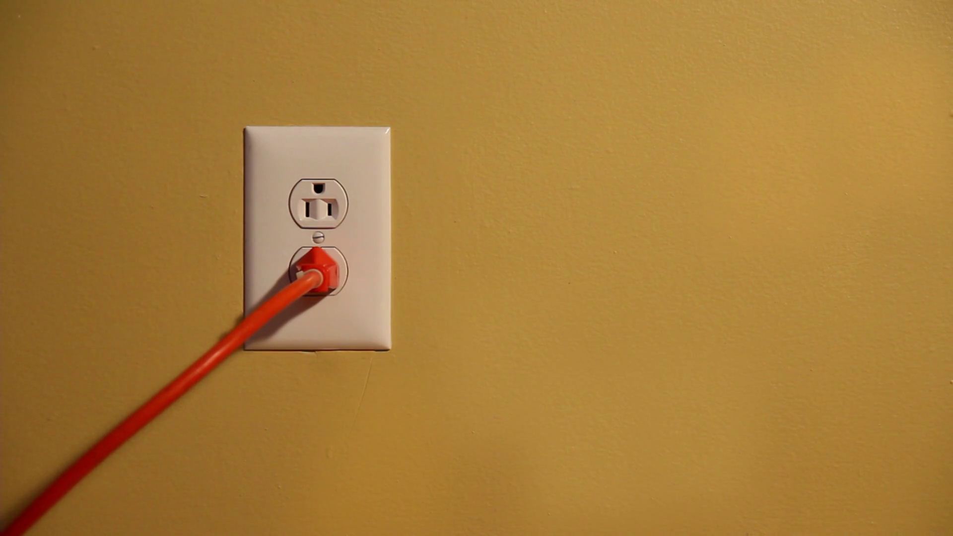 Plugging In Extension Cord In Wall Socket Stock Footage SBV300230593