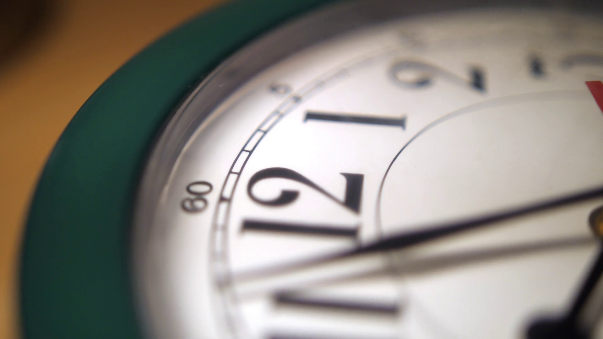 An extreme close up of the hands on a typical household wall clock