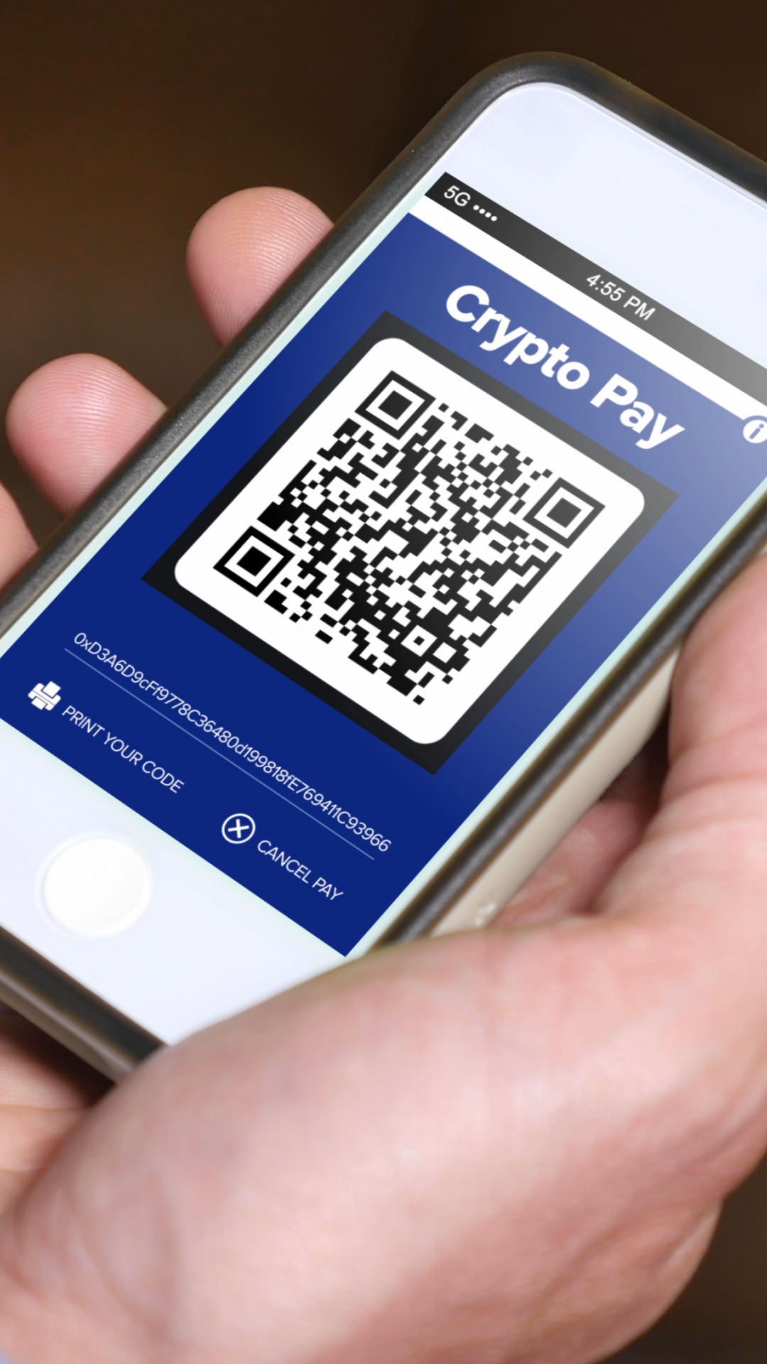Vertical view of a man showing his cryptocurrency wallet address QR code,  ready for a payment. Screen contents are fictional.
