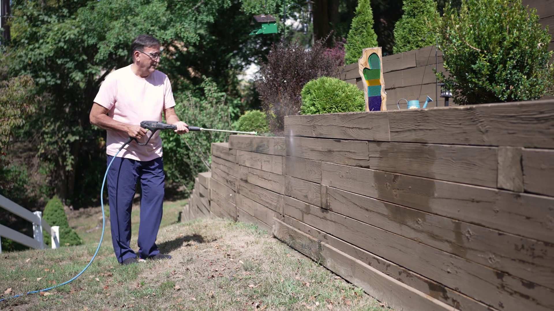 A Wide Shot View Of Homeowner Power Washing Stock Footage SBV-352783494 ...