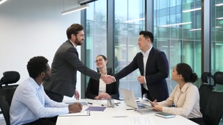 Group businesspeople make agreement Ending team meeting decision and profitable deal, finish planning cooperation shake hands accomplish in conference room. Successful business negotiations handshake