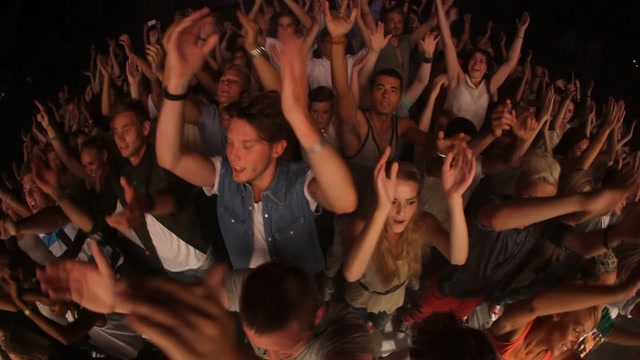 One Person Cheering In A Crowd