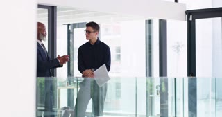 Business people, office hallway and talking of company ideas, planning and advice for teamwork or collaboration