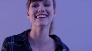 Face, thinking and a woman laughing on a purple background in studio for comedy or humor