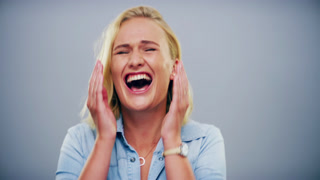 Funny, woman and laughing in studio with face of happiness, freedom or reaction to crazy joke
