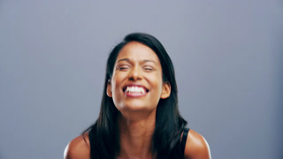 Funny, face and black woman in studio laugh with happiness, freedom or reaction to joke