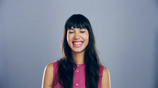 Goofy, face and woman laughing in a studio for funny, comic and silly joke or emoji