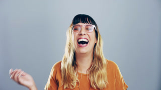 Comic, face and woman laughing in a studio for funny or silly joke in conversation with happiness