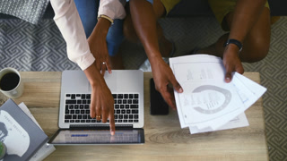 hands, laptop and bills for home planning, financial paperwork and website information of loan registration