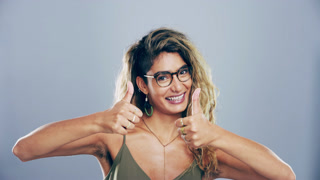 Woman, student and thumbs up for success, learning support and vote or like emoji in a studio portrait