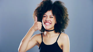 African woman, thumbs up and happy for support, agreement or subscribe, vote and like emoji in studio