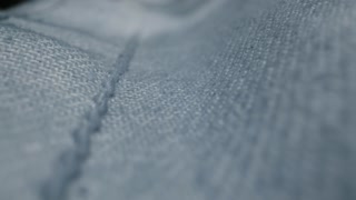 Blue textile jeans cloth texture close-up macro. Fashion fabric multicolor. Cotton casual clothes