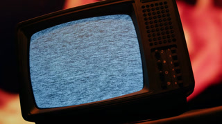 Retro TV, vintage television In a nostalgic setup, a retro TV displays grain on screen, scary halloween night device good for chroma key and