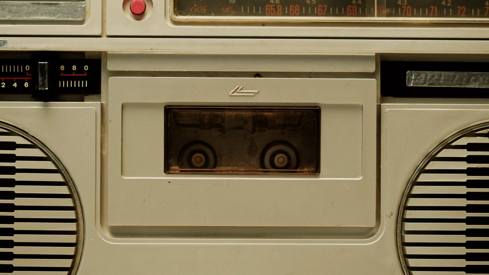 Retro radio tape recorder closeup. Listening to music, using cassette