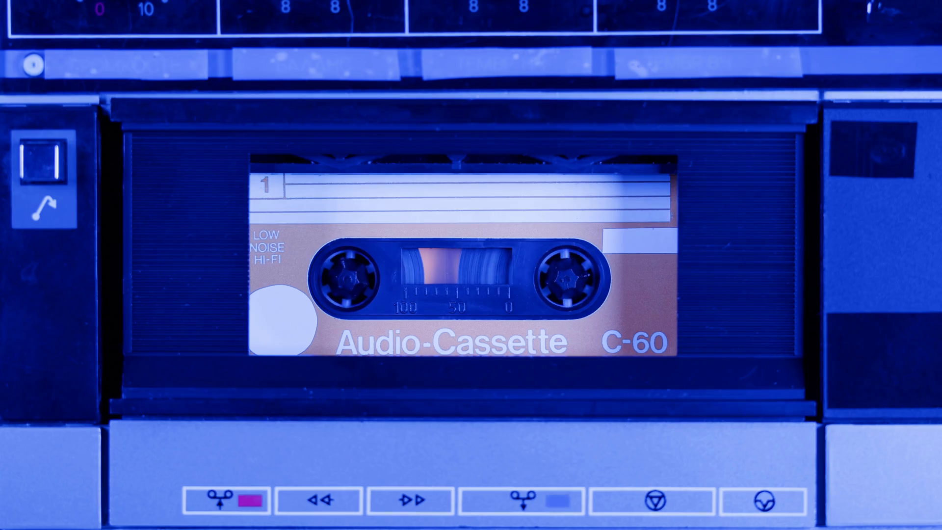 Retro radio tape recorder, audio cassette closeup. Listening to music